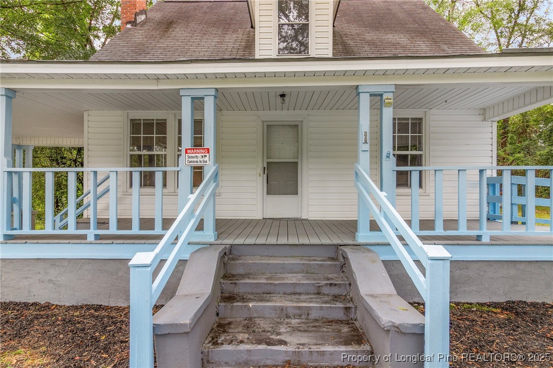 402 Morro Street Fairmont, NC 28340 - Photo 4 of 36 front view of a house with large windows