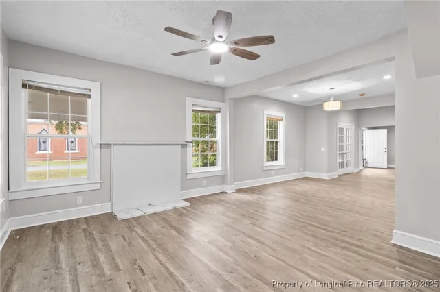 a view of an empty room with a window