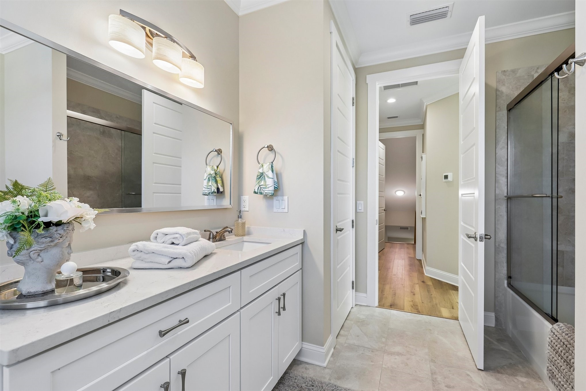 1012 White Street Fernandina Beach, FL 32034 - Photo 31 of 35 a spacious bathroom with a granite countertop sink and a mirror