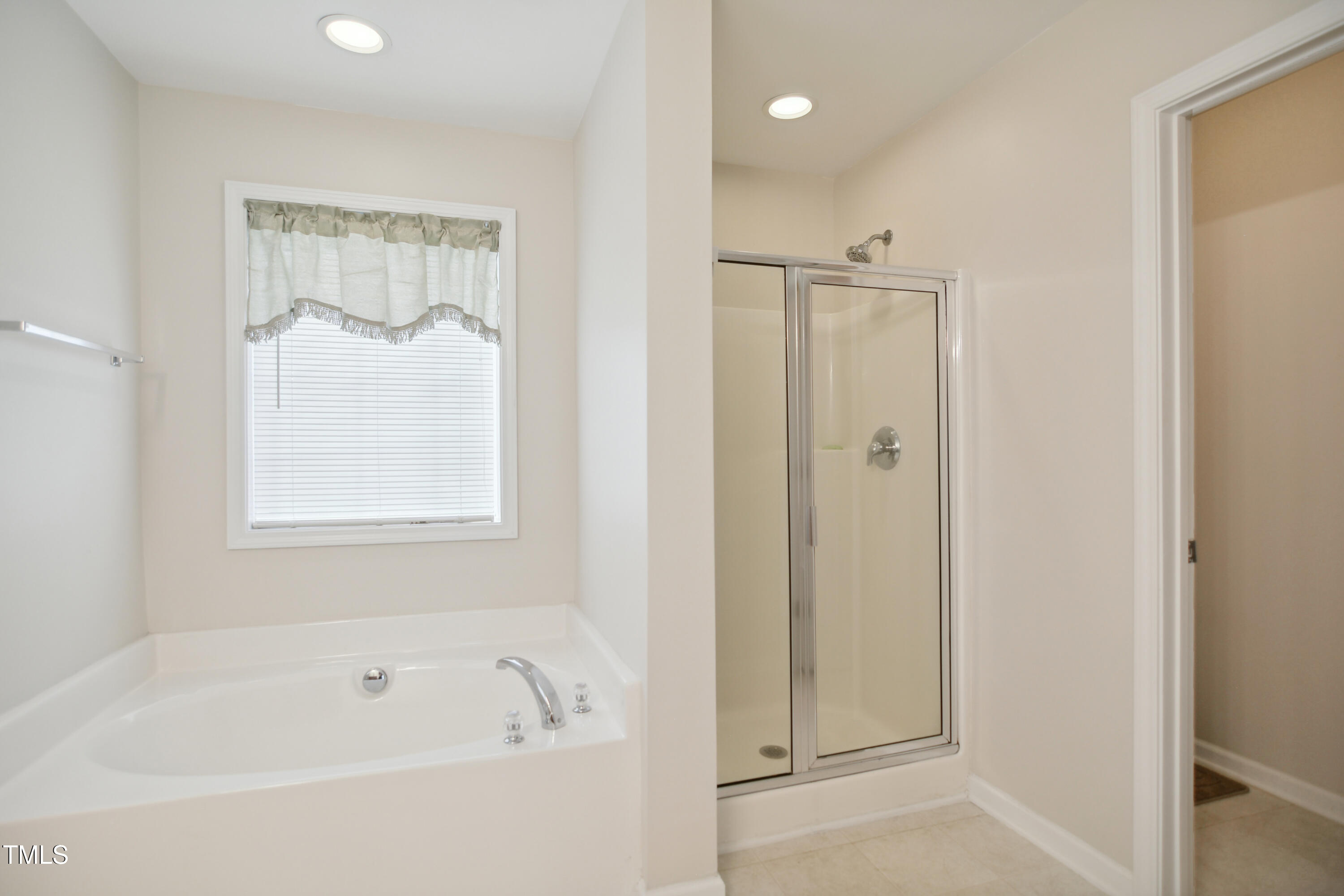 101 Whitney Lane Durham, NC 27713 - Photo 16 of 28 a white bath tub sitting next to a shower