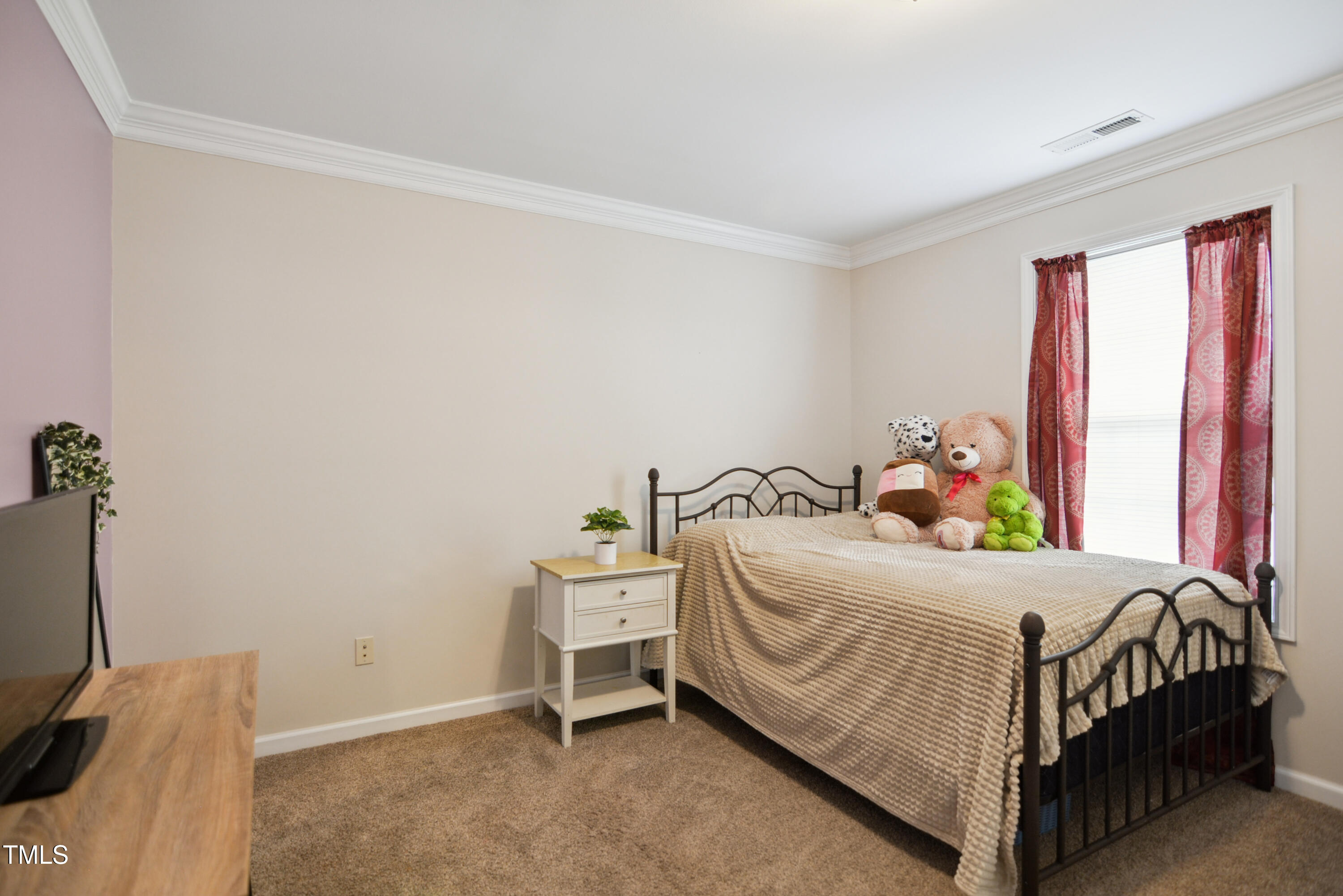 101 Whitney Lane Durham, NC 27713 - Photo 19 of 28 a bedroom with a bed and a window