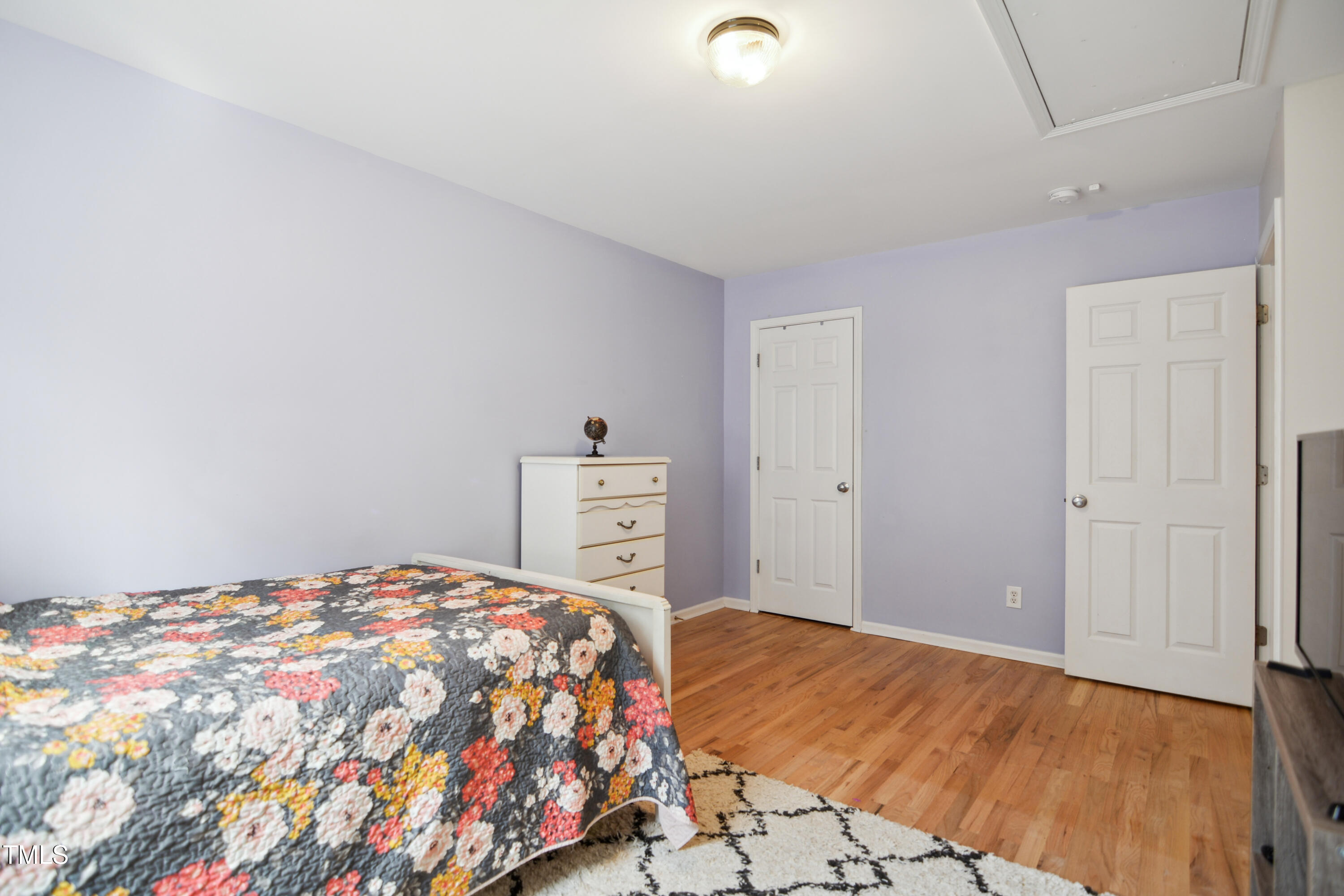 101 Whitney Lane Durham, NC 27713 - Photo 22 of 28 a bedroom with a bed and a cabinets