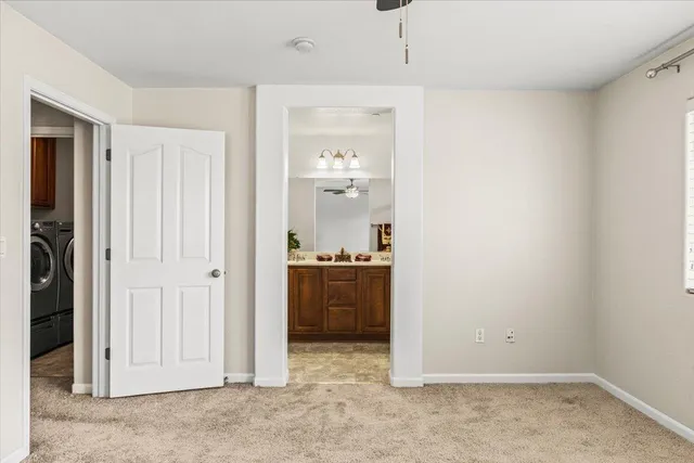 an empty room with kitchen and a sink