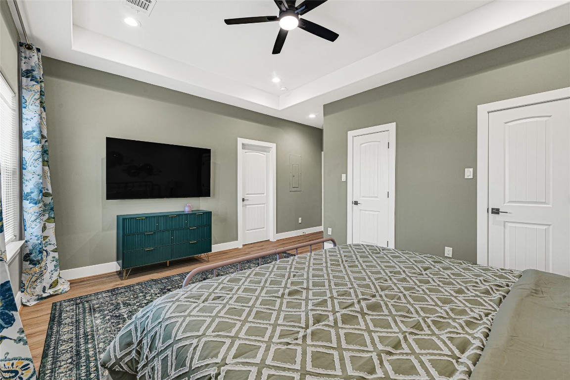 3510 Rebecca Street Houston, TX 77021 - Photo 22 of 28 a bedroom with a bed and a flat screen tv