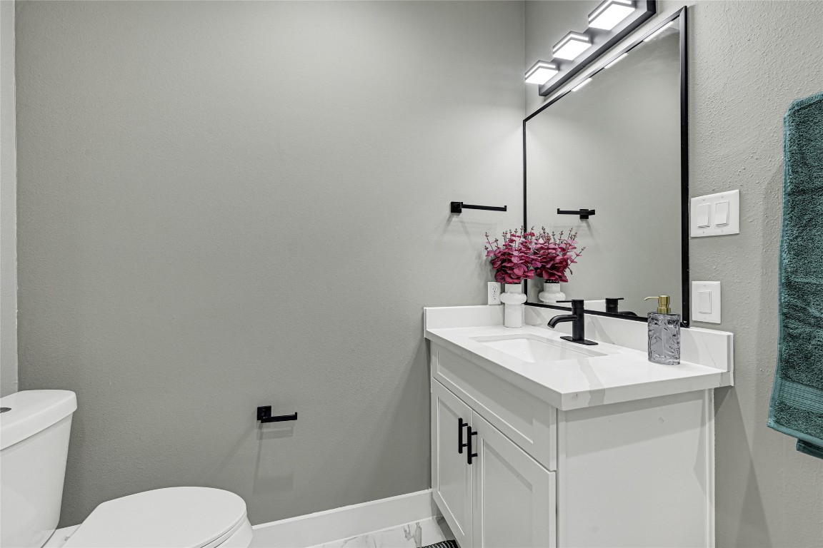 3510 Rebecca Street Houston, TX 77021 - Photo 8 of 28 a bathroom with a sink vanity mirror and toilet