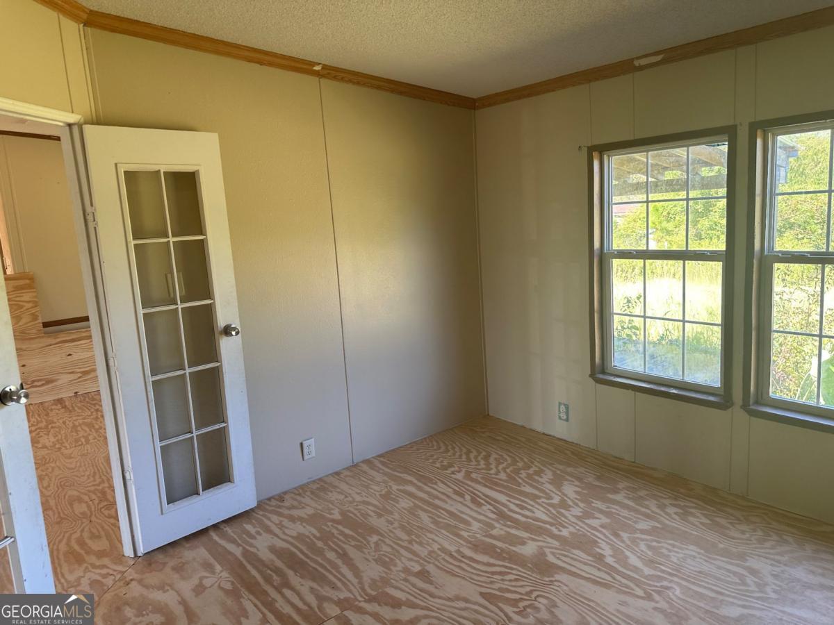 642 Still Road Alamo, GA 30411 - Photo 12 of 21 an empty room with windows