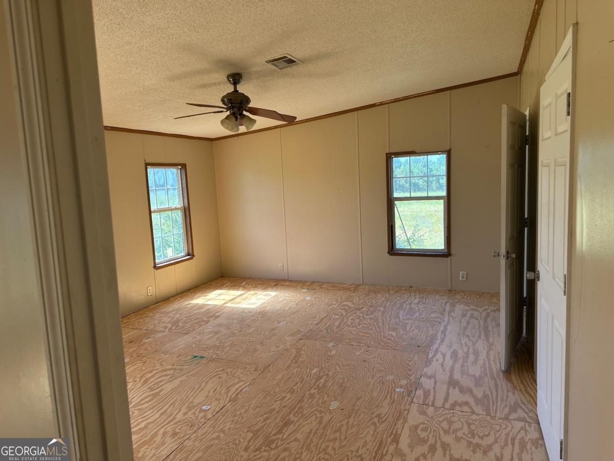 642 Still Road Alamo, GA 30411 - Photo 17 of 21 a view of empty room with windows