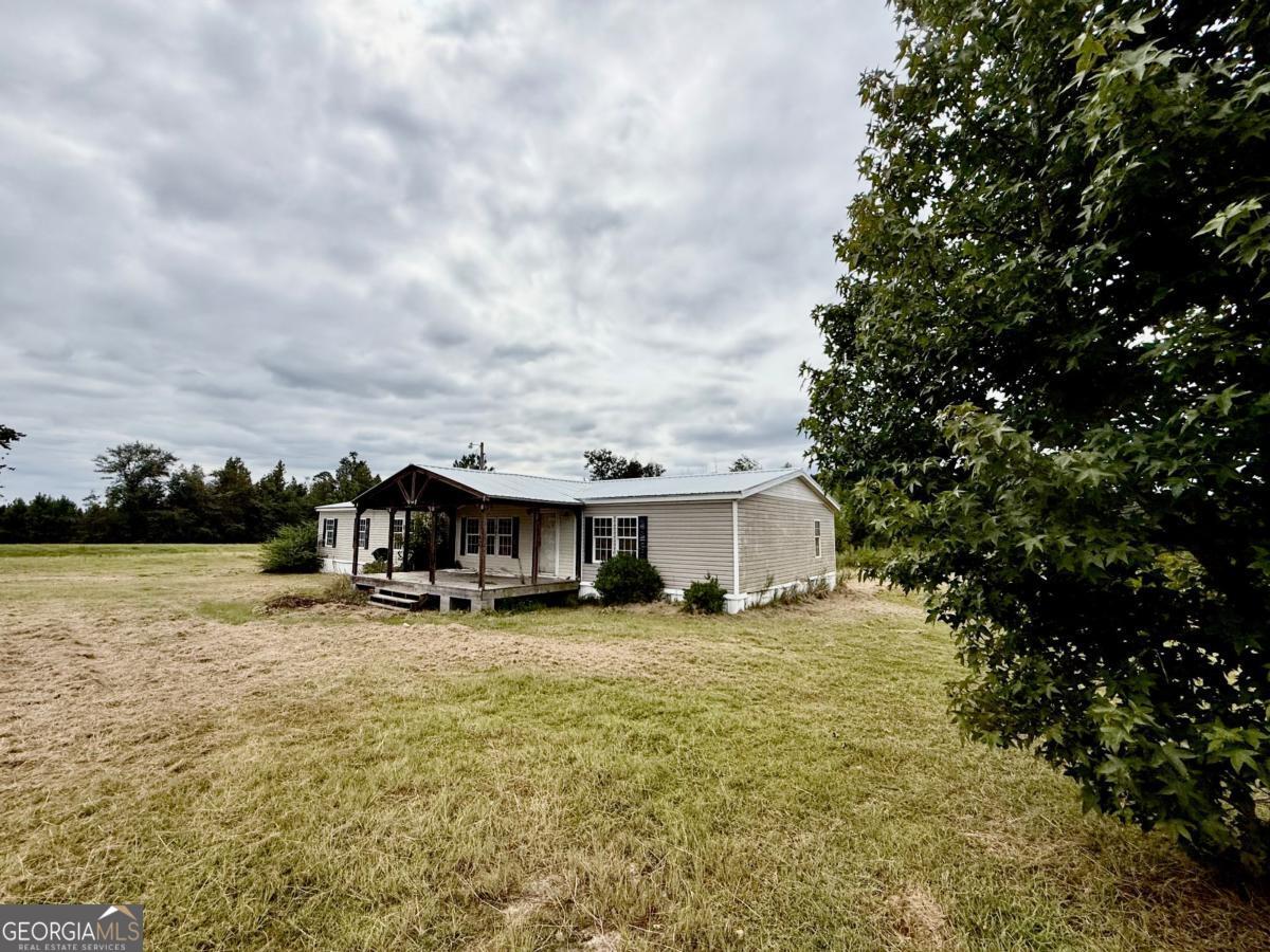 642 Still Road Alamo, GA 30411 - Photo 18 of 21 a view of a house with yard and sitting area