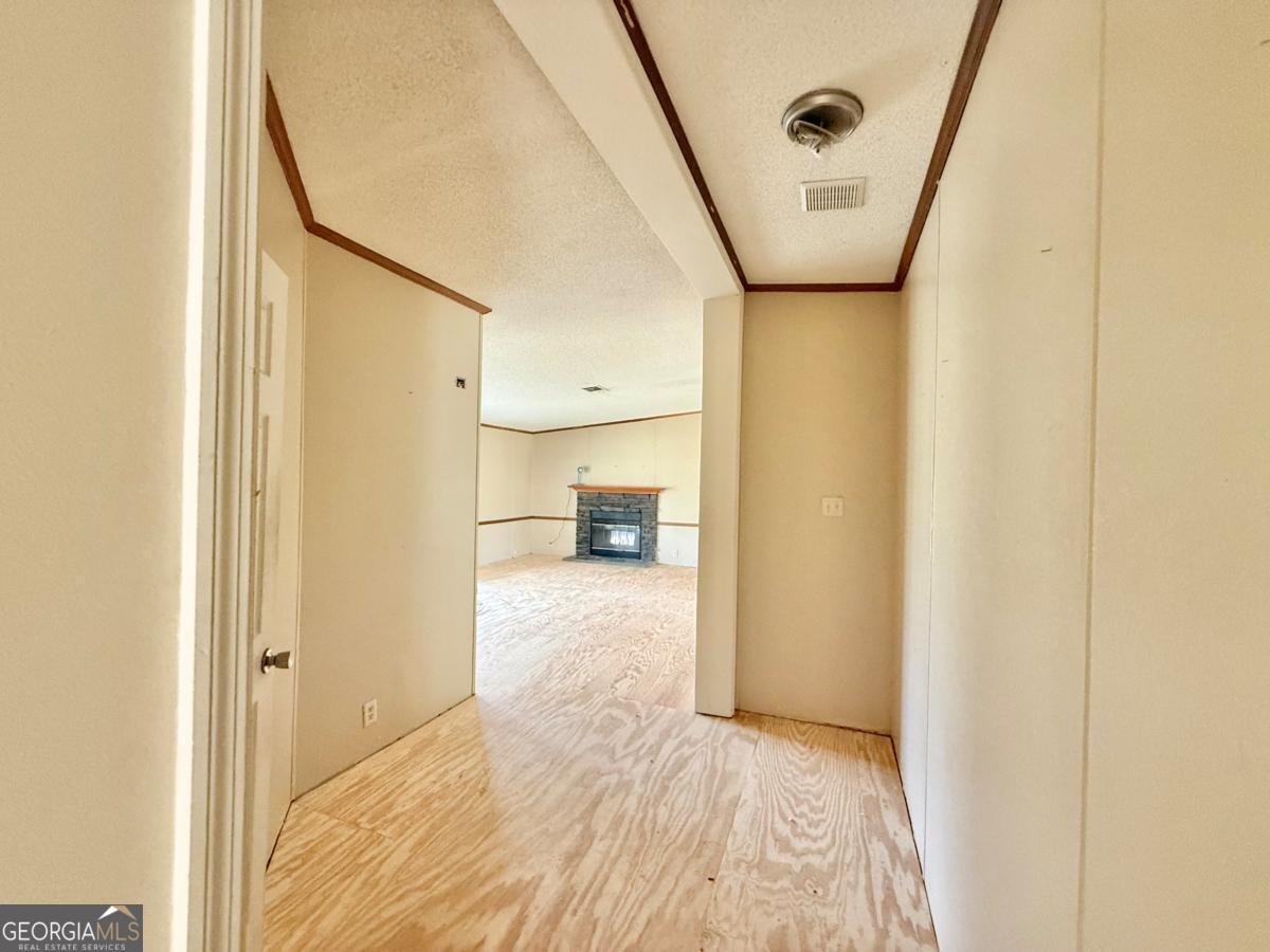 642 Still Road Alamo, GA 30411 - Photo 5 of 21 a view of a big room with wooden floor and windows