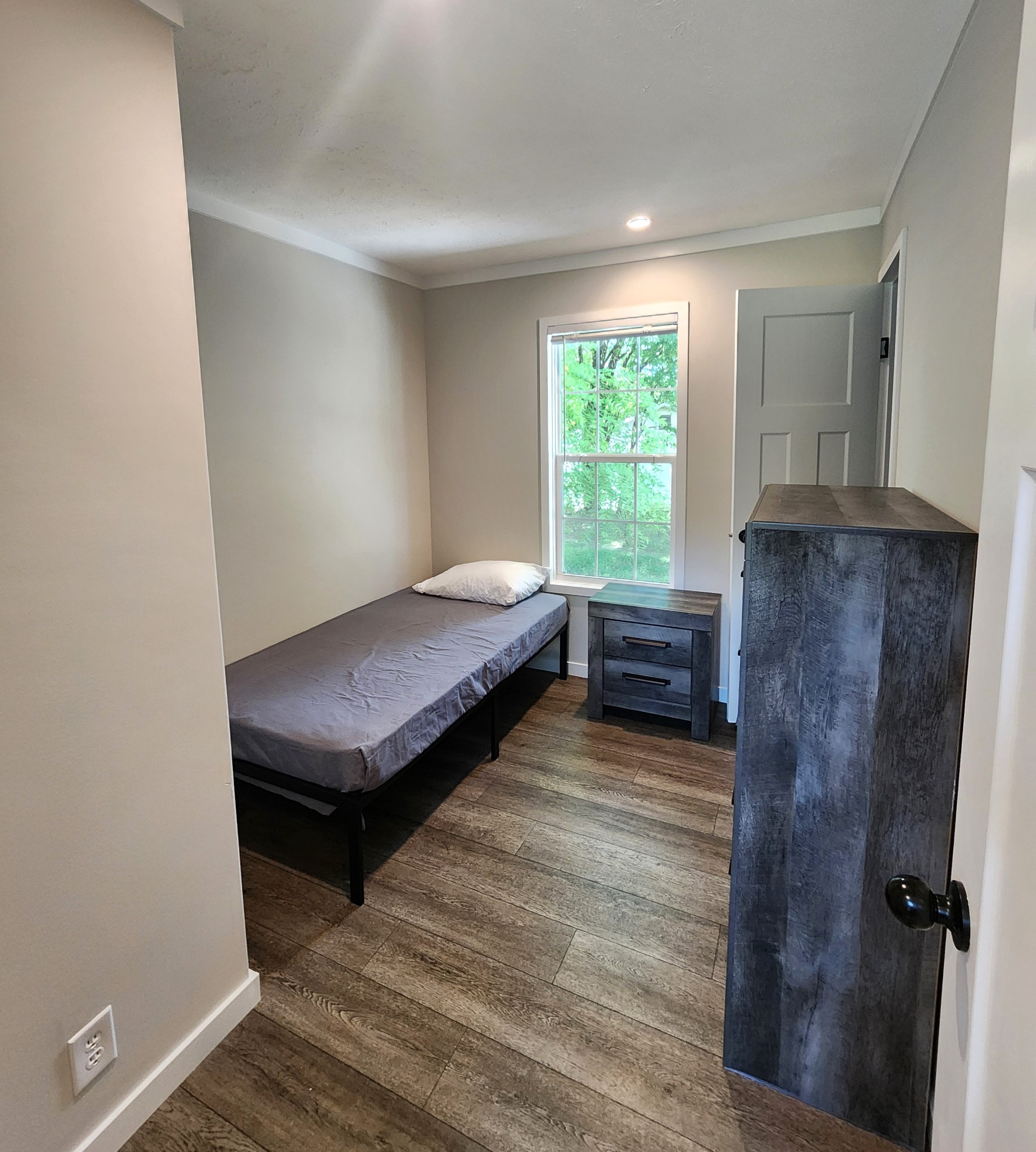 23 Yates Street Paris, TN 38242 - Photo 12 of 17 a bedroom with a bed and a window