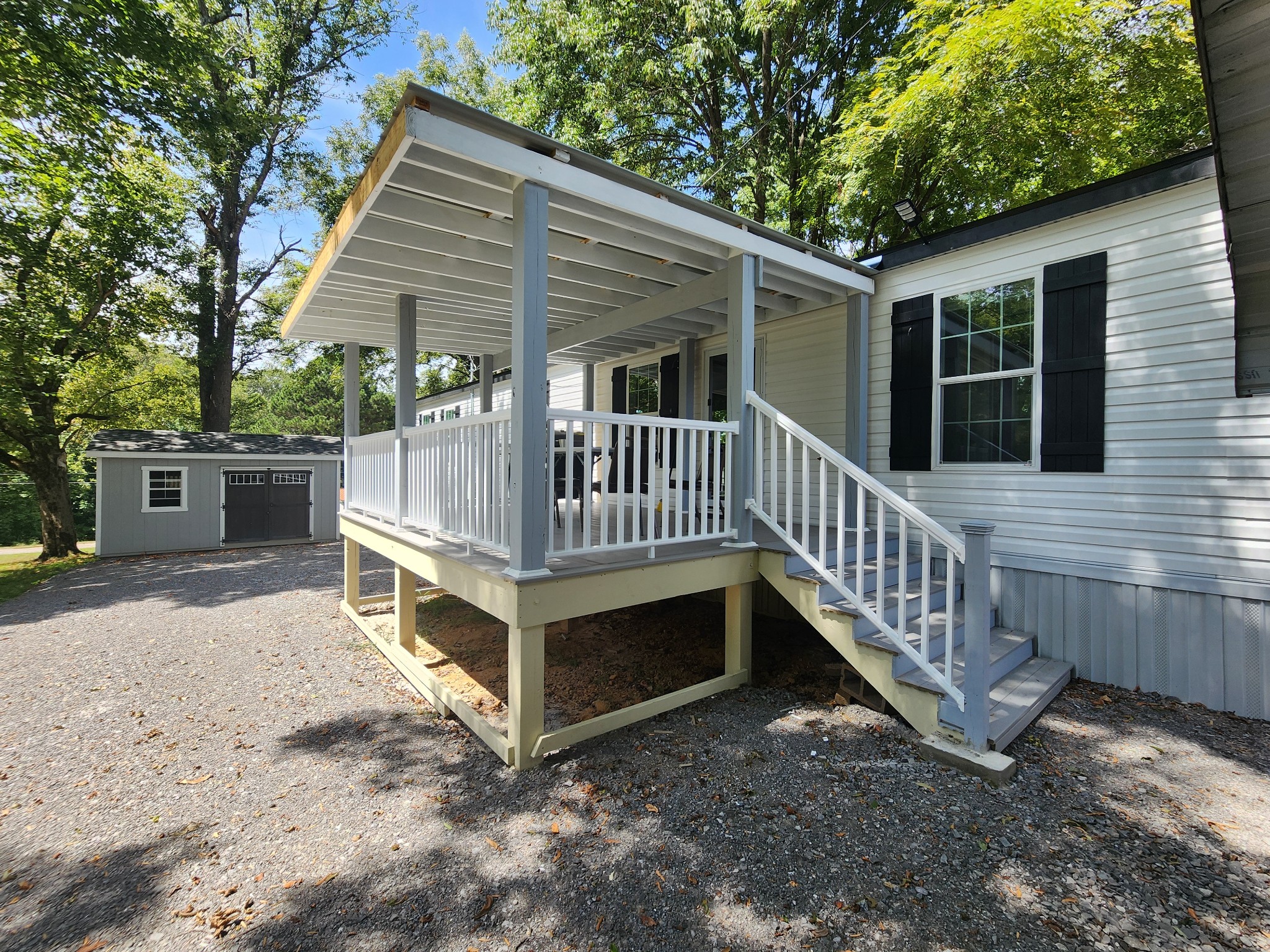 23 Yates Street Paris, TN 38242 - Photo 14 of 17 a view of a house with a yard and a deck