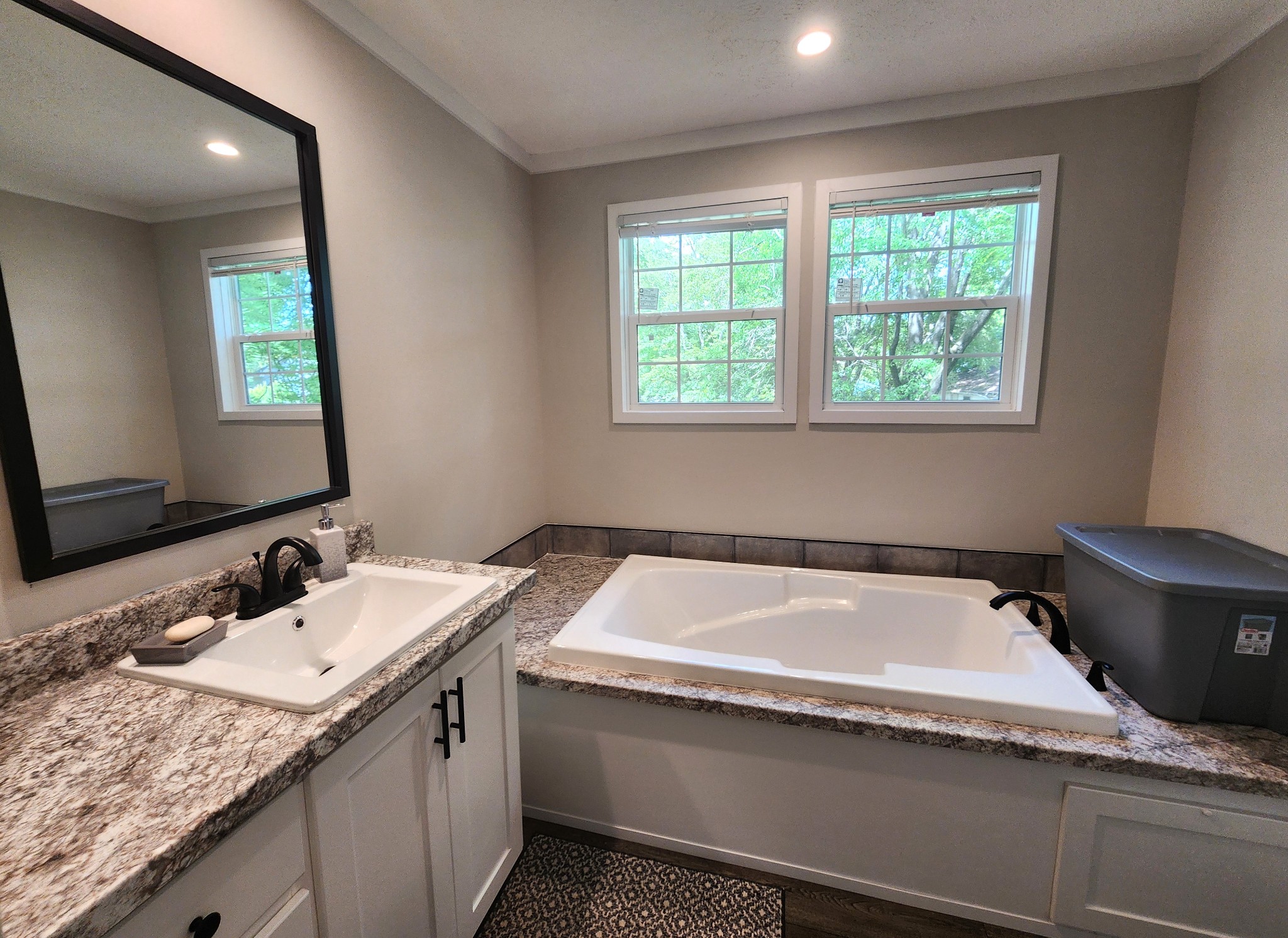 23 Yates Street Paris, TN 38242 - Photo 8 of 17 a bathroom with a granite countertop sink and a bathtub