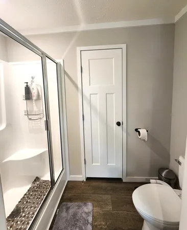 a bathroom with a sink a mirror and a shower
