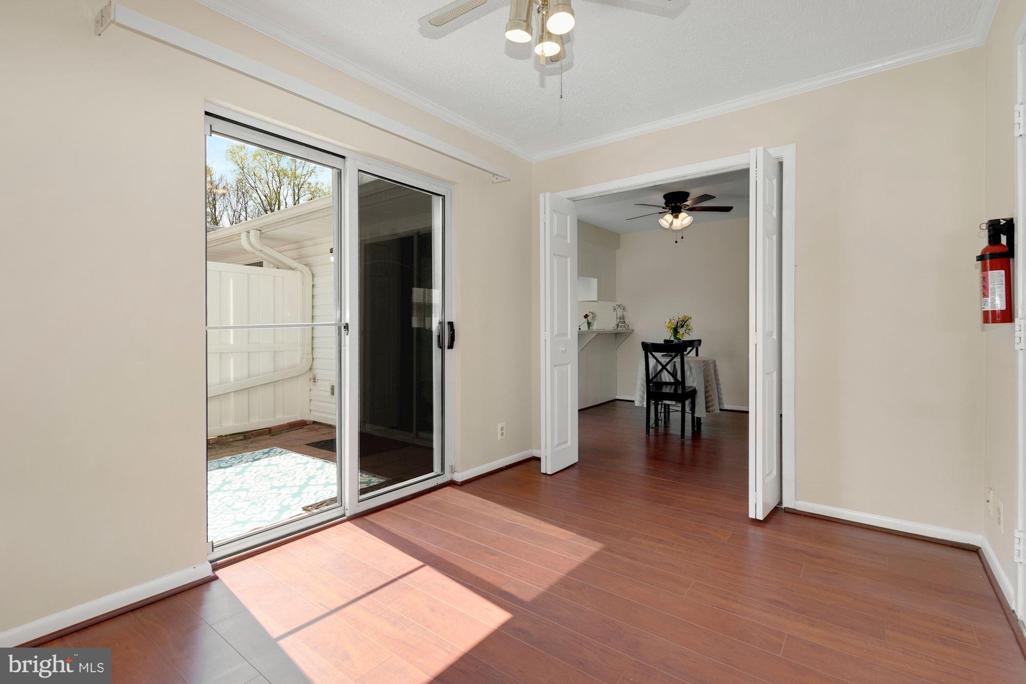3568 Fiske Terrace, Unit 144B Silver Spring, MD 20906 - Photo 16 of 35 Den/office with sliding glass door to patio