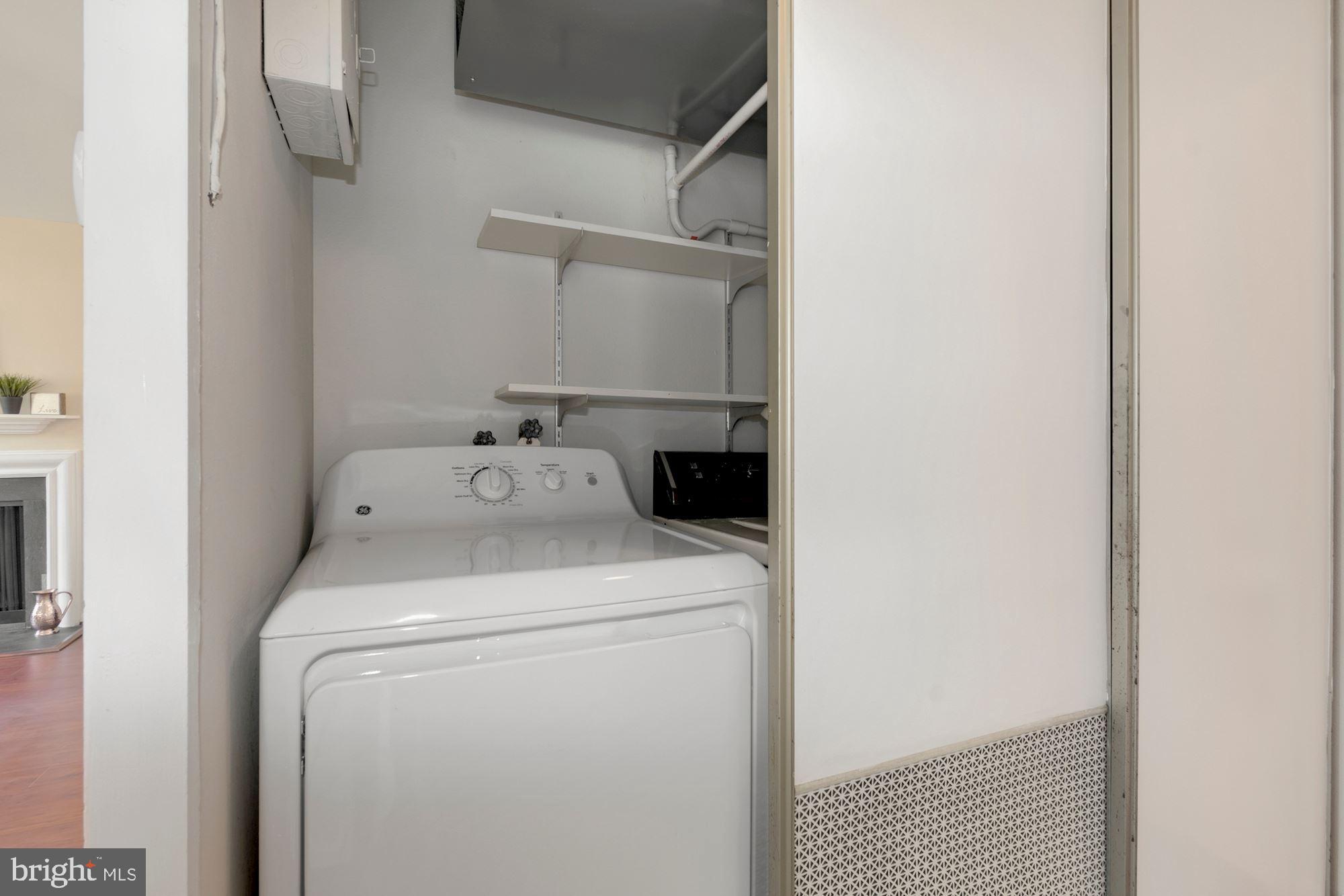 3568 Fiske Terrace, Unit 144B Silver Spring, MD 20906 - Photo 23 of 35 Washer/dryer unit off bathroom