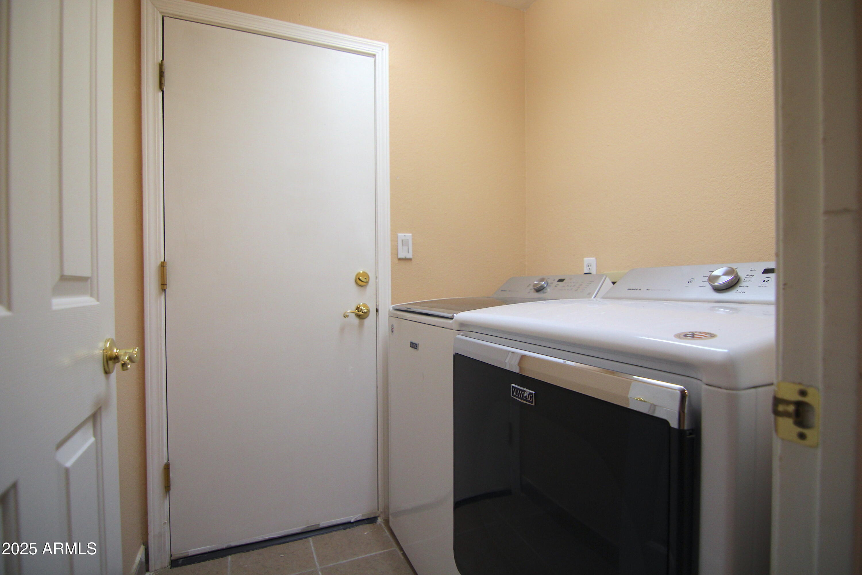 3569 East Utopia Road Phoenix, AZ 85050 - Photo 13 of 16 a utility room with dryer and washer