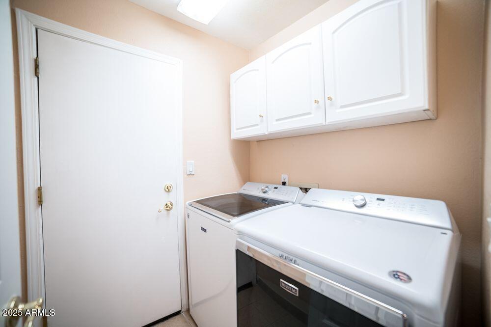 3569 East Utopia Road Phoenix, AZ 85050 - Photo 14 of 16 a utility room with dryer and washer