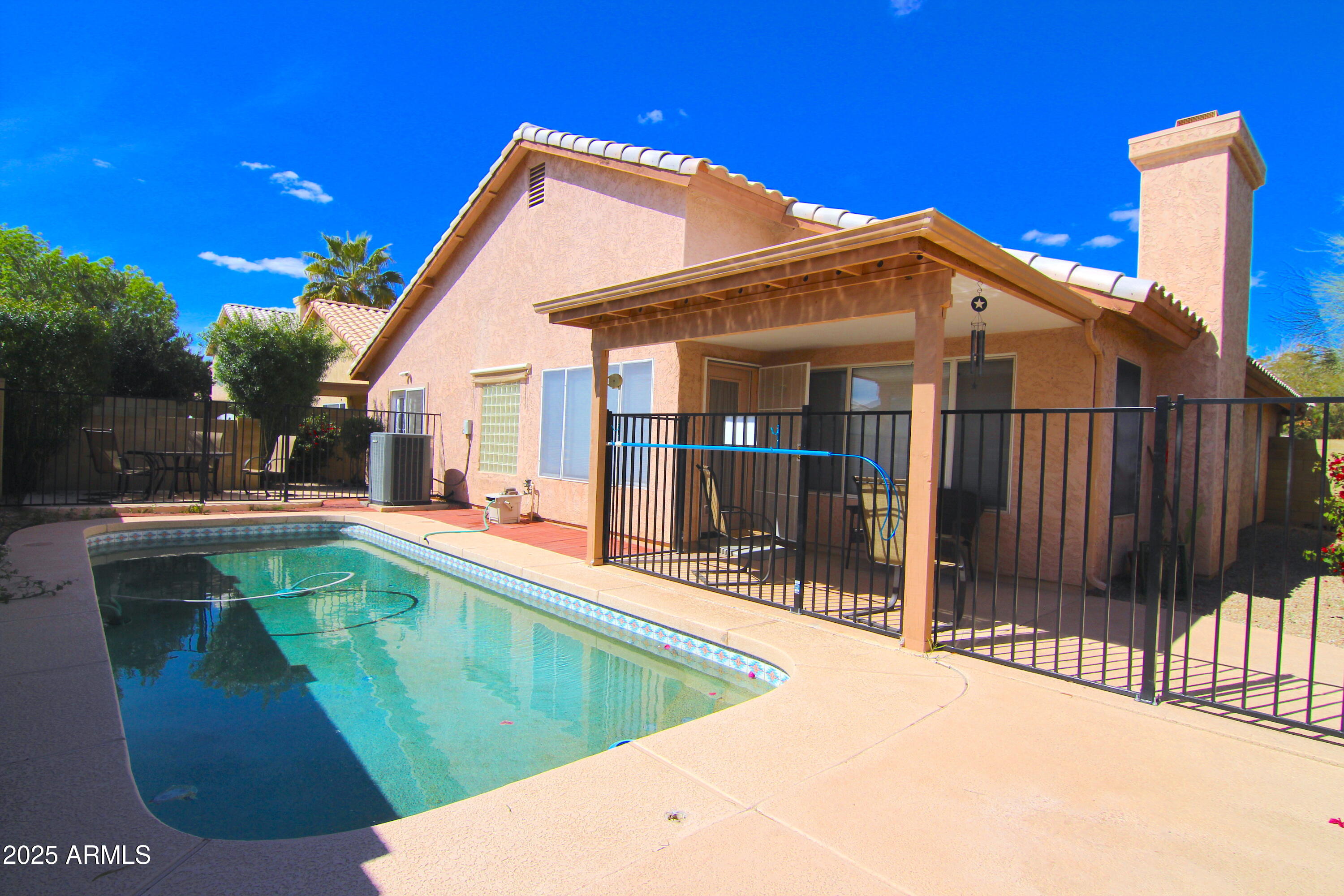 3569 East Utopia Road Phoenix, AZ 85050 - Photo 16 of 16 a view of a house with pool and sitting area