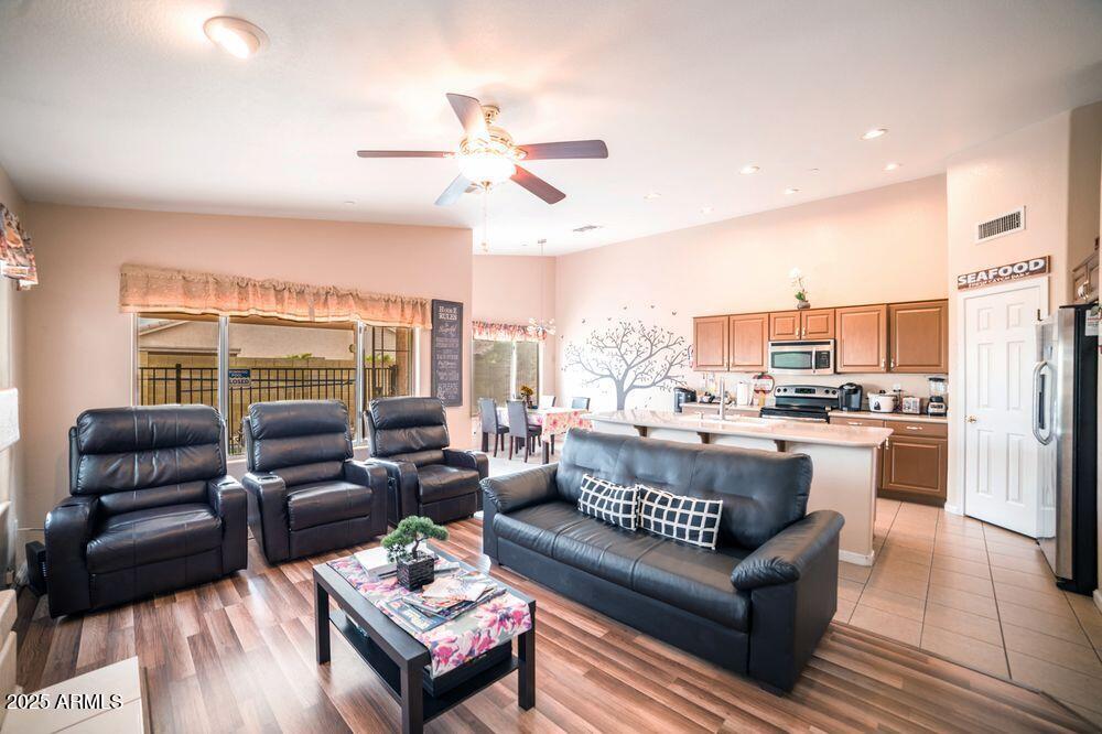 3569 East Utopia Road Phoenix, AZ 85050 - Photo 5 of 16 a living room with furniture and a large window
