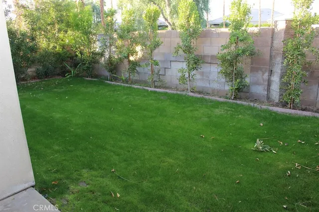 a view of a lake with a table and chairs