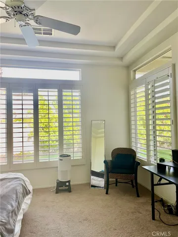 a en suite bathroom with a double vanity sink and a mirror