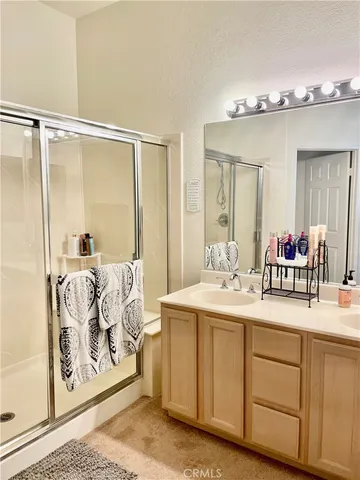 a bedroom with a bed and a wall painting