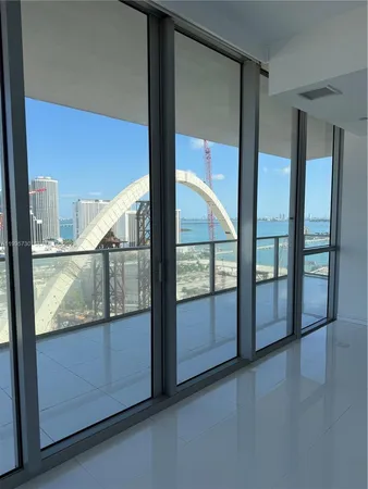 a kitchen with refrigerator a washer and dryer