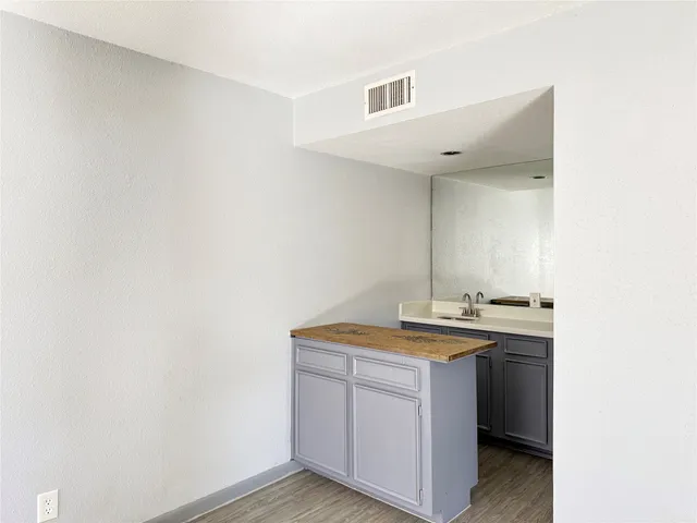 a utility room with sink dryer and washer