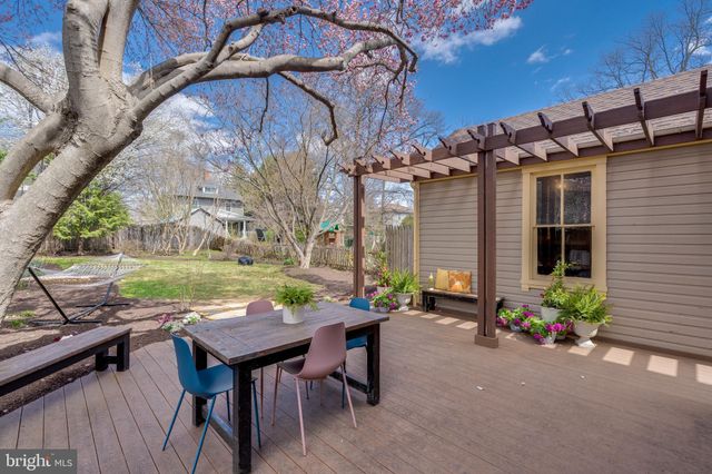 a view of a backyard with sitting area