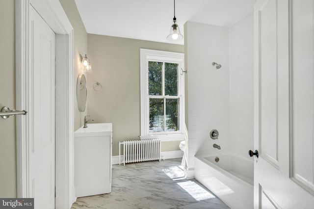 a view of storage and utility room with washer and dryer