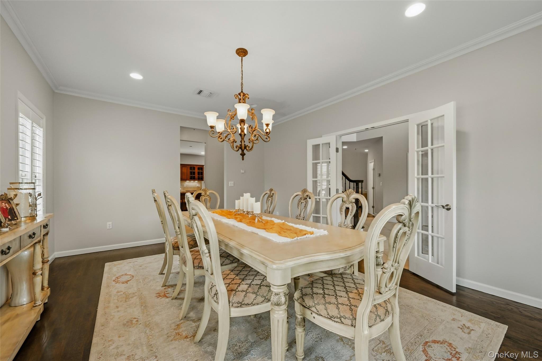 51 Meriwether Trail Congers, NY 10920 - Photo 6 of 50 Formal dining room featuring dark wood-finish flooring, a decorative chandelier, recessed lighting, and white crown molding
