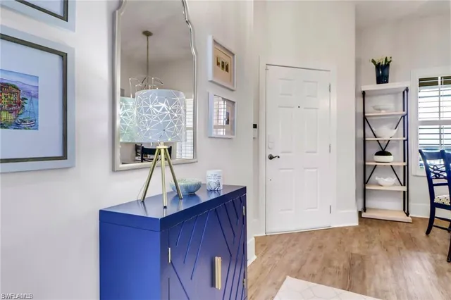 a view of entryway and hall with wooden floor