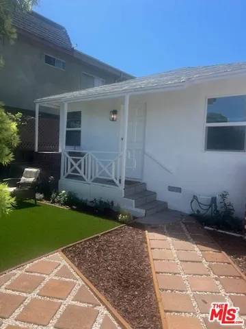 a house view with a garden space