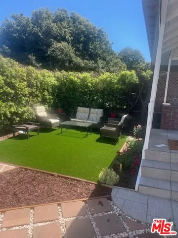 a view of a park with large trees