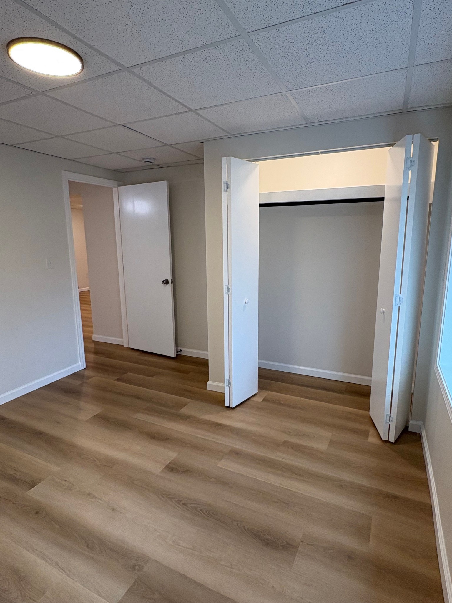 606 Dover Road, Unit 1 Clarksville, TN 37042 - Photo 6 of 12 a view of an empty room with wooden floor and closet