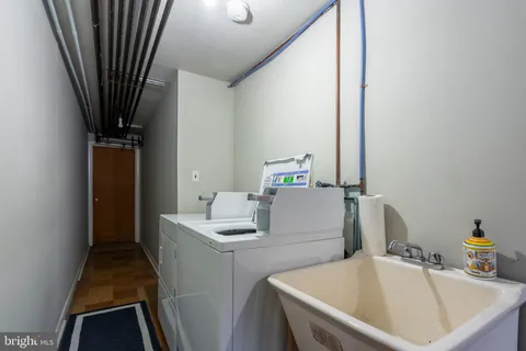 a bathroom with a sink a mirror and a bathtub