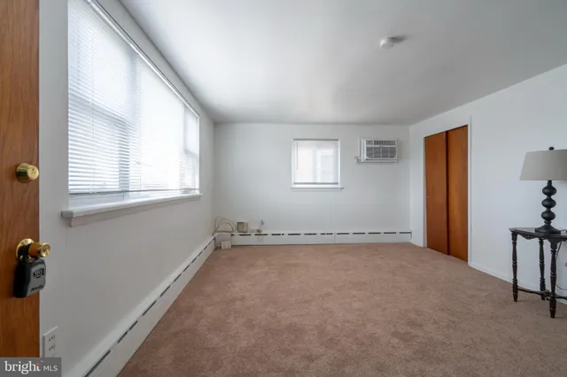 a view of an empty room with a window