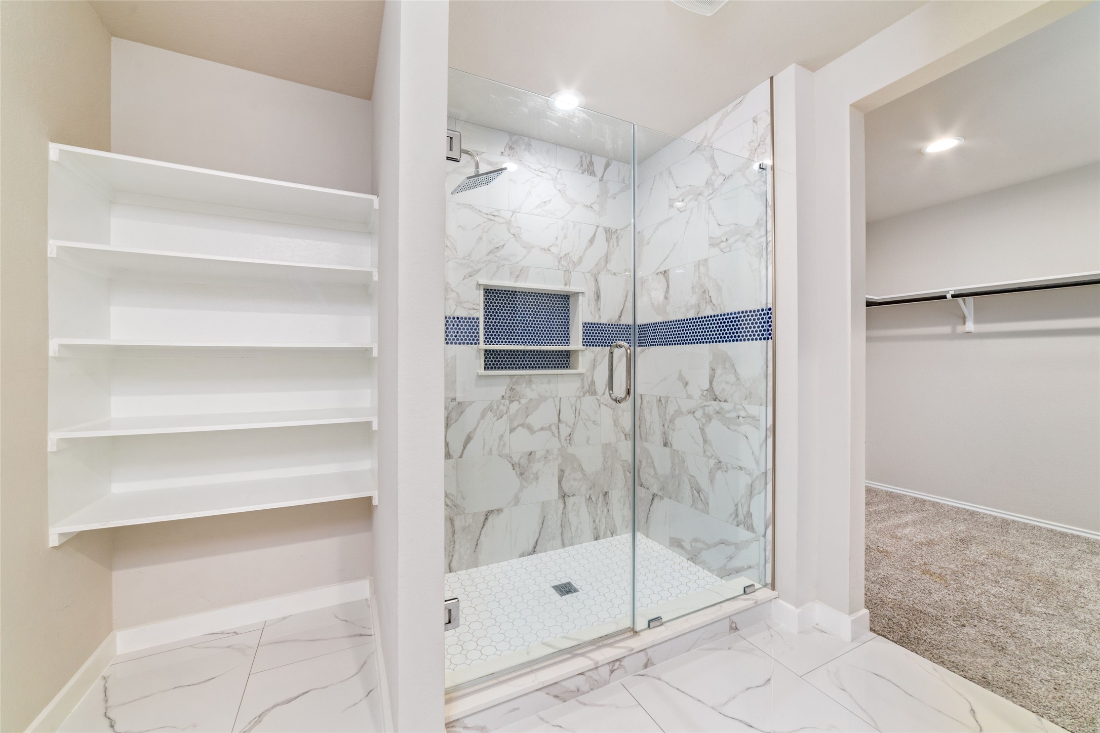 5502 Creekside Ridge Trail Katy, TX 77449 - Photo 21 of 25 a bathroom with a glass shower door