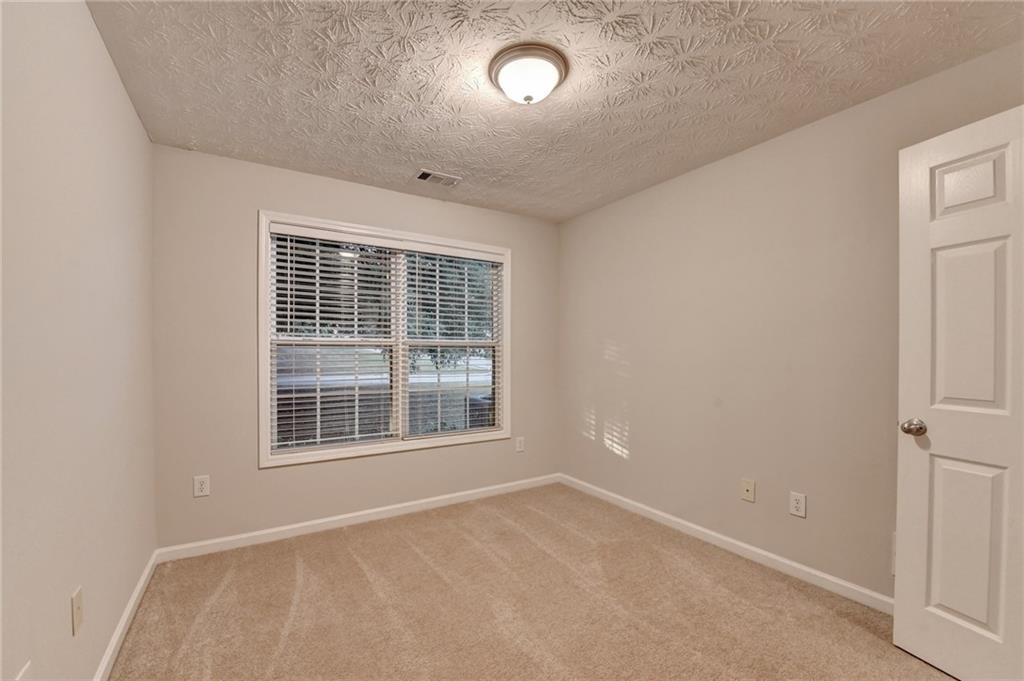 310 Andrew Ridge Drive Jefferson, GA 30549 - Photo 27 of 52 an empty room with a window