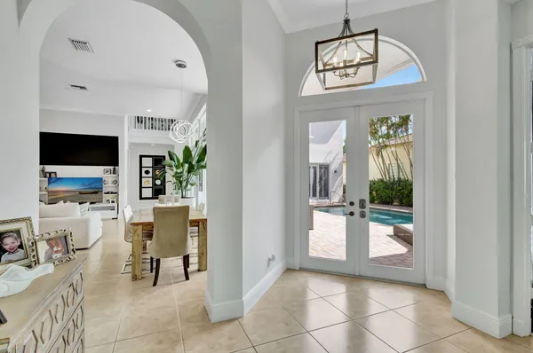 a kitchen with stainless steel appliances granite countertop a refrigerator sink and stove
