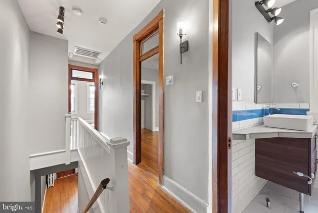 a bathroom with a sink a mirror and a shower