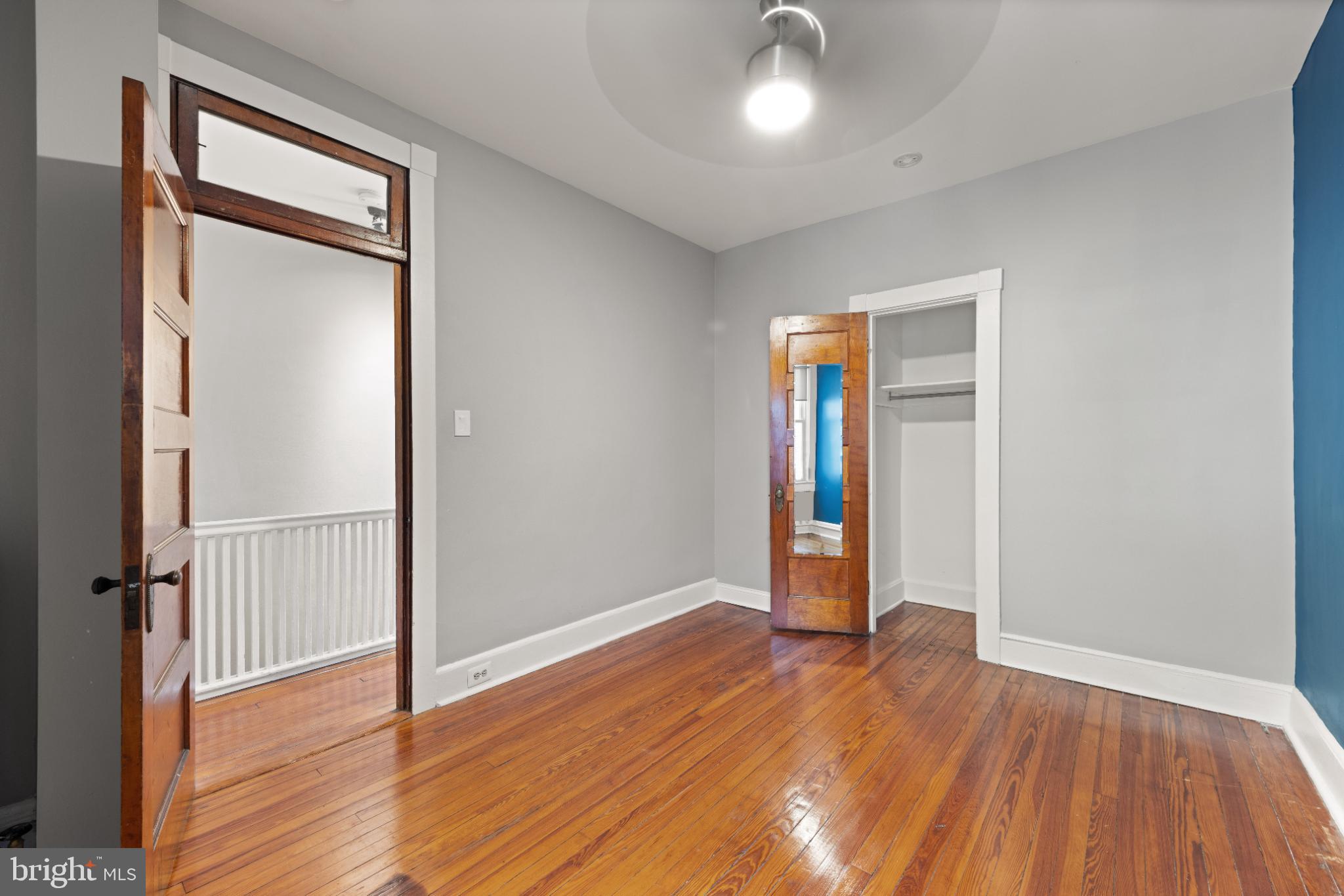 445 Newton Place Northwest Washington, DC 20010 - Photo 14 of 26 an empty room with wooden floor and closet