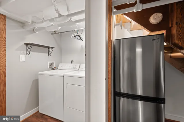 a utility room with dryer and washer