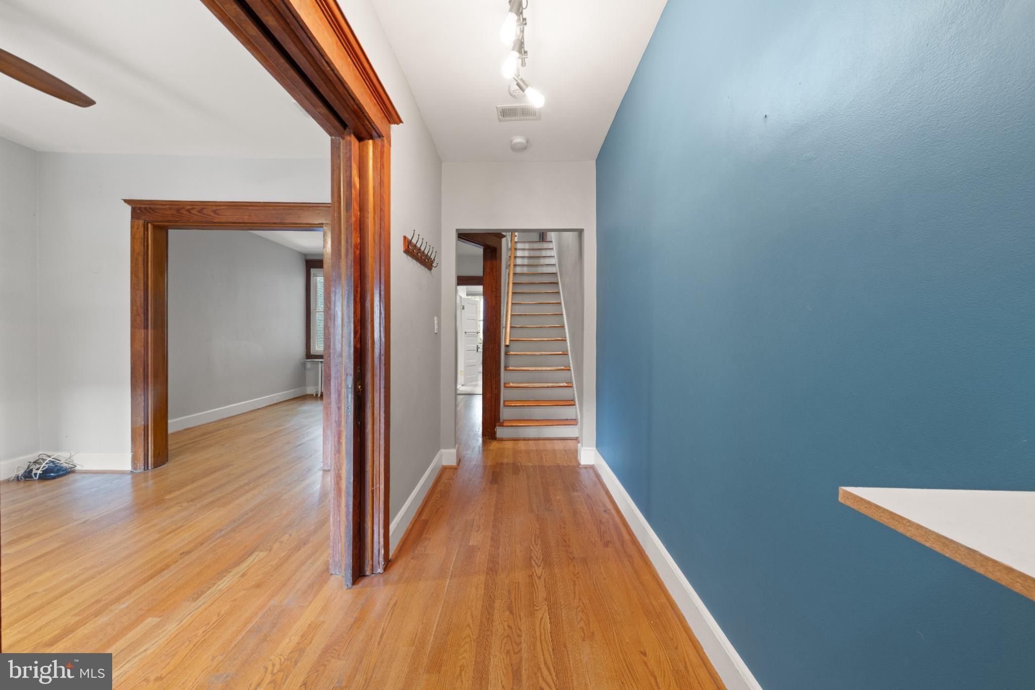 445 Newton Place Northwest Washington, DC 20010 - Photo 3 of 26 a view of a hallway with wooden floor
