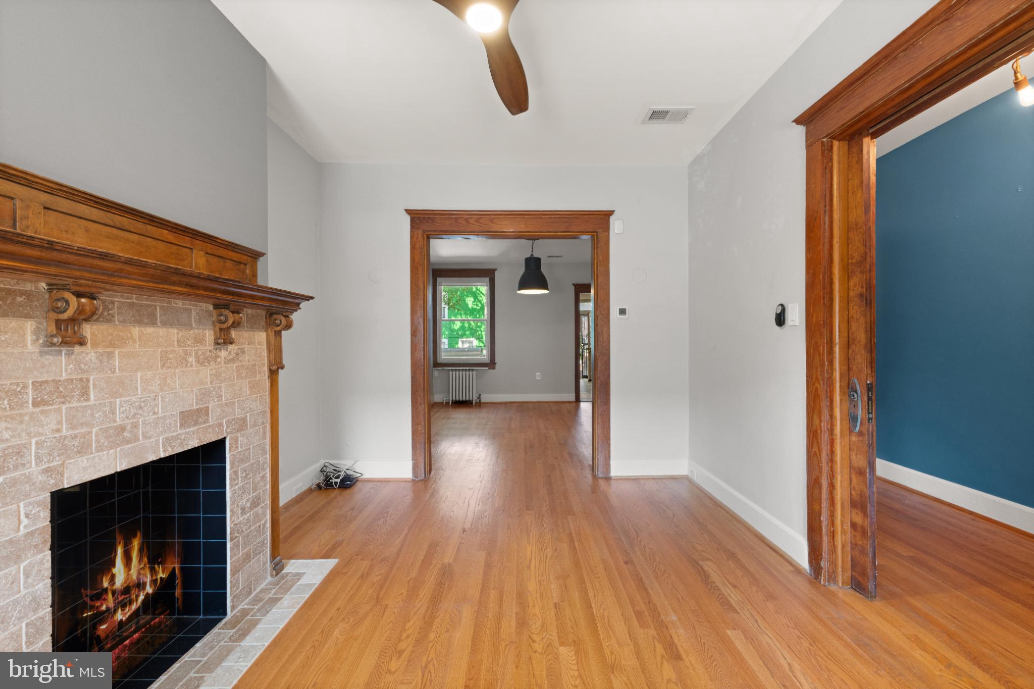 445 Newton Place Northwest Washington, DC 20010 - Photo 7 of 26 a view of a livingroom with wooden floor and a fireplace