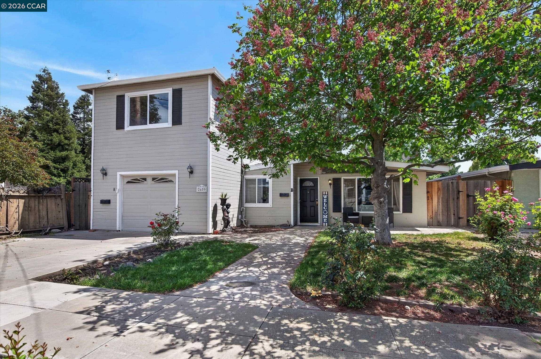 2659 3rd Street Livermore, CA 94550 - Photo 1 of 40 a front view of a house with a yard and trees