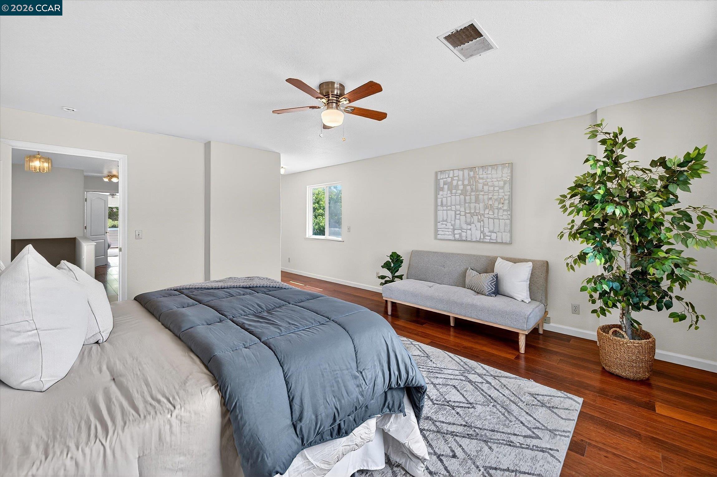 2659 3rd Street Livermore, CA 94550 - Photo 12 of 40 a bedroom with a bed and a potted plant
