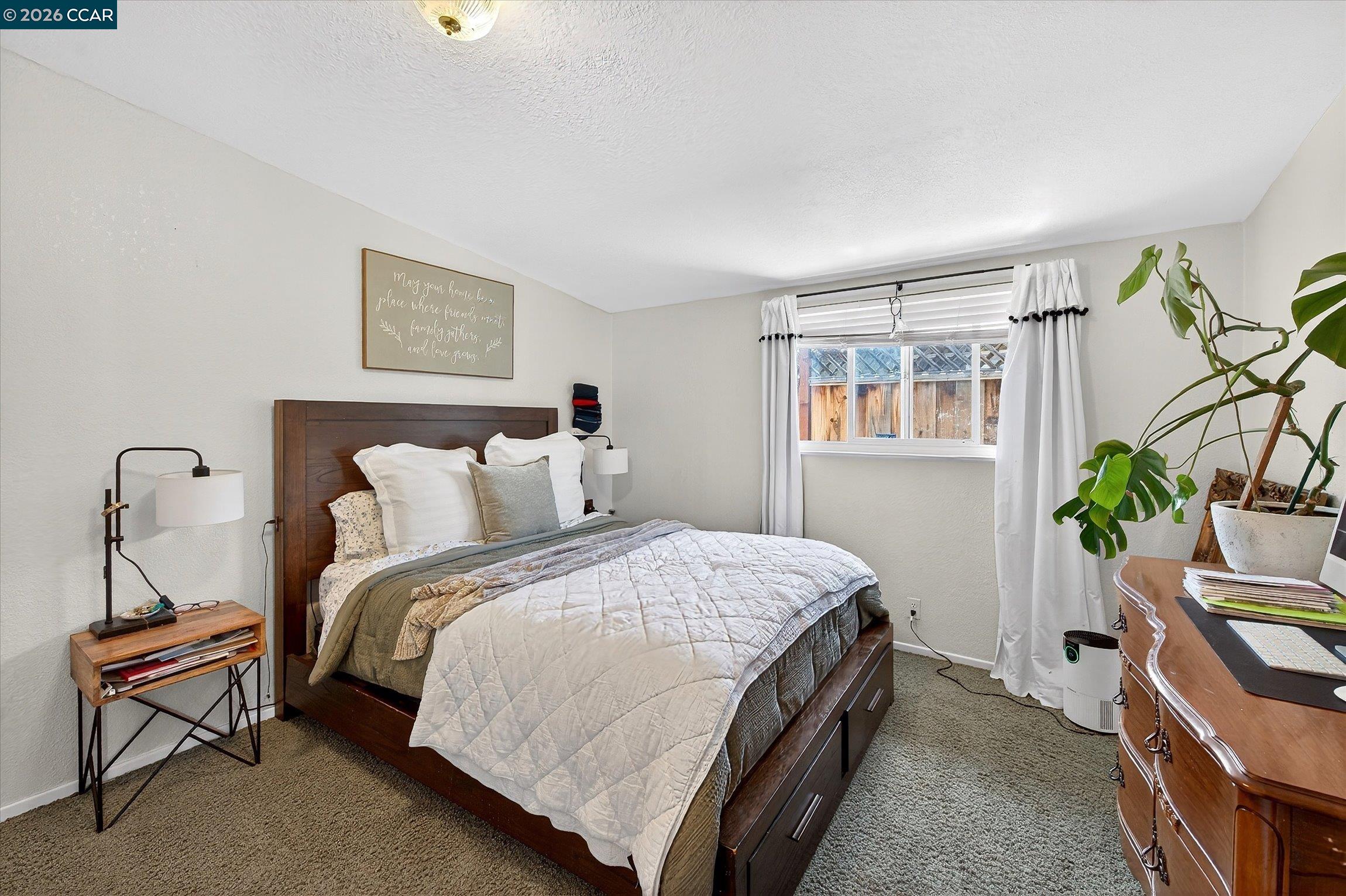 2659 3rd Street Livermore, CA 94550 - Photo 15 of 40 a bedroom with bed and a potted plant