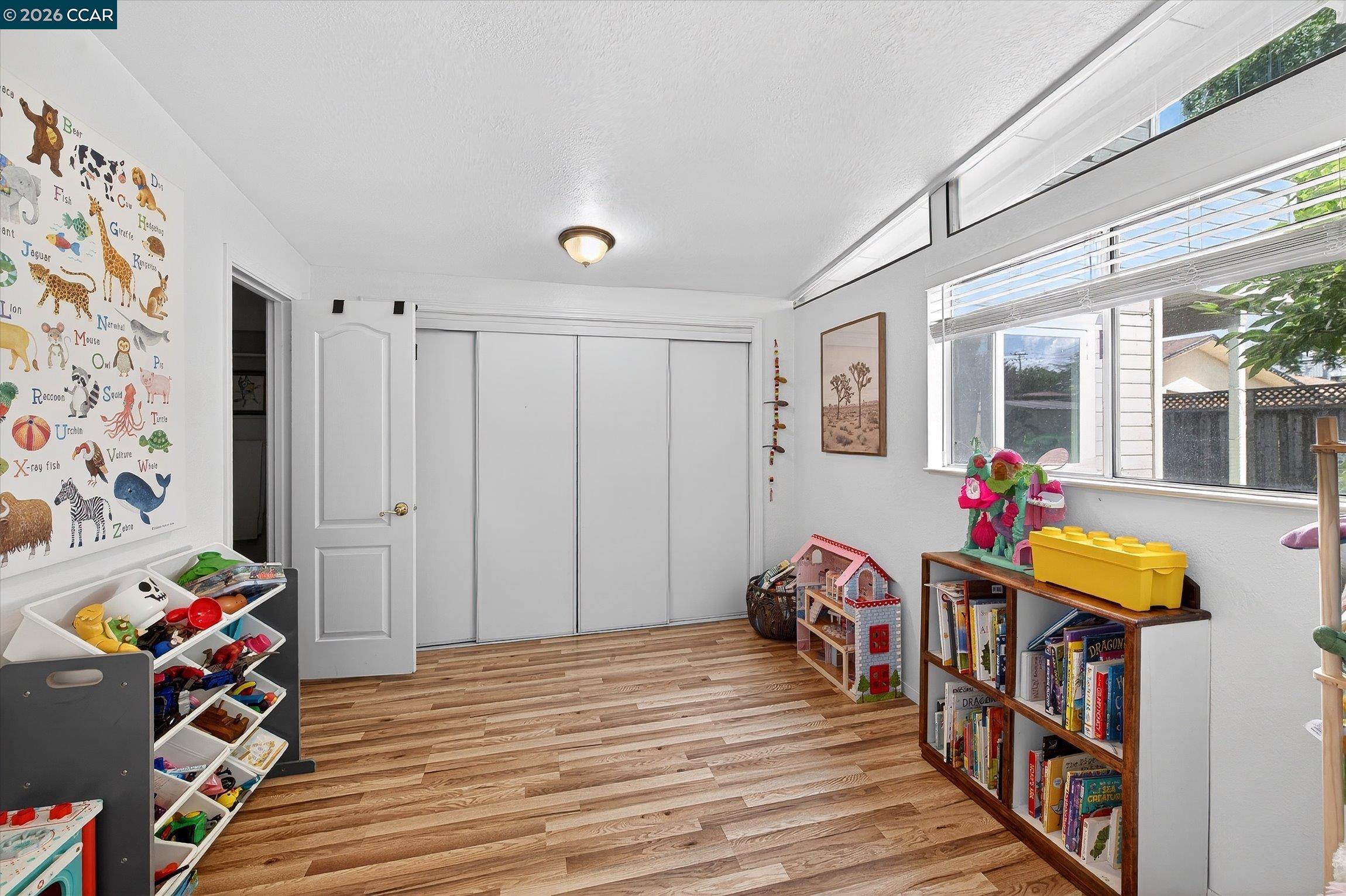 2659 3rd Street Livermore, CA 94550 - Photo 19 of 40 a bedroom with furniture and a book shelf