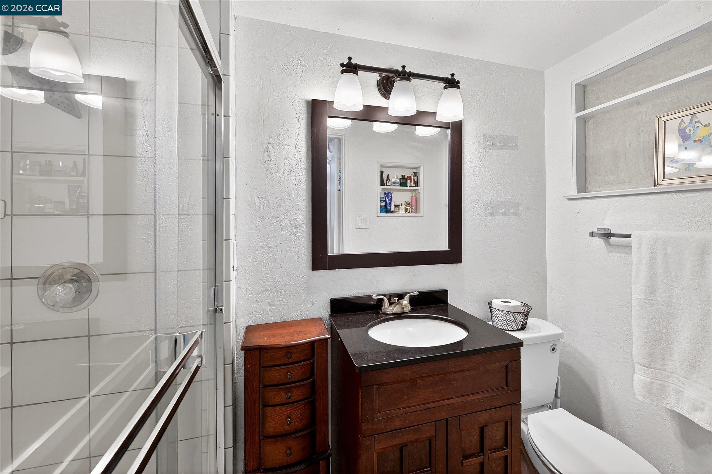 2659 3rd Street Livermore, CA 94550 - Photo 21 of 40 a bathroom with a sink a toilet and shower